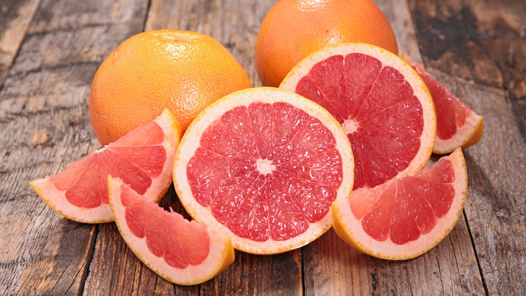 Pink grapefruit sliced in two on a table