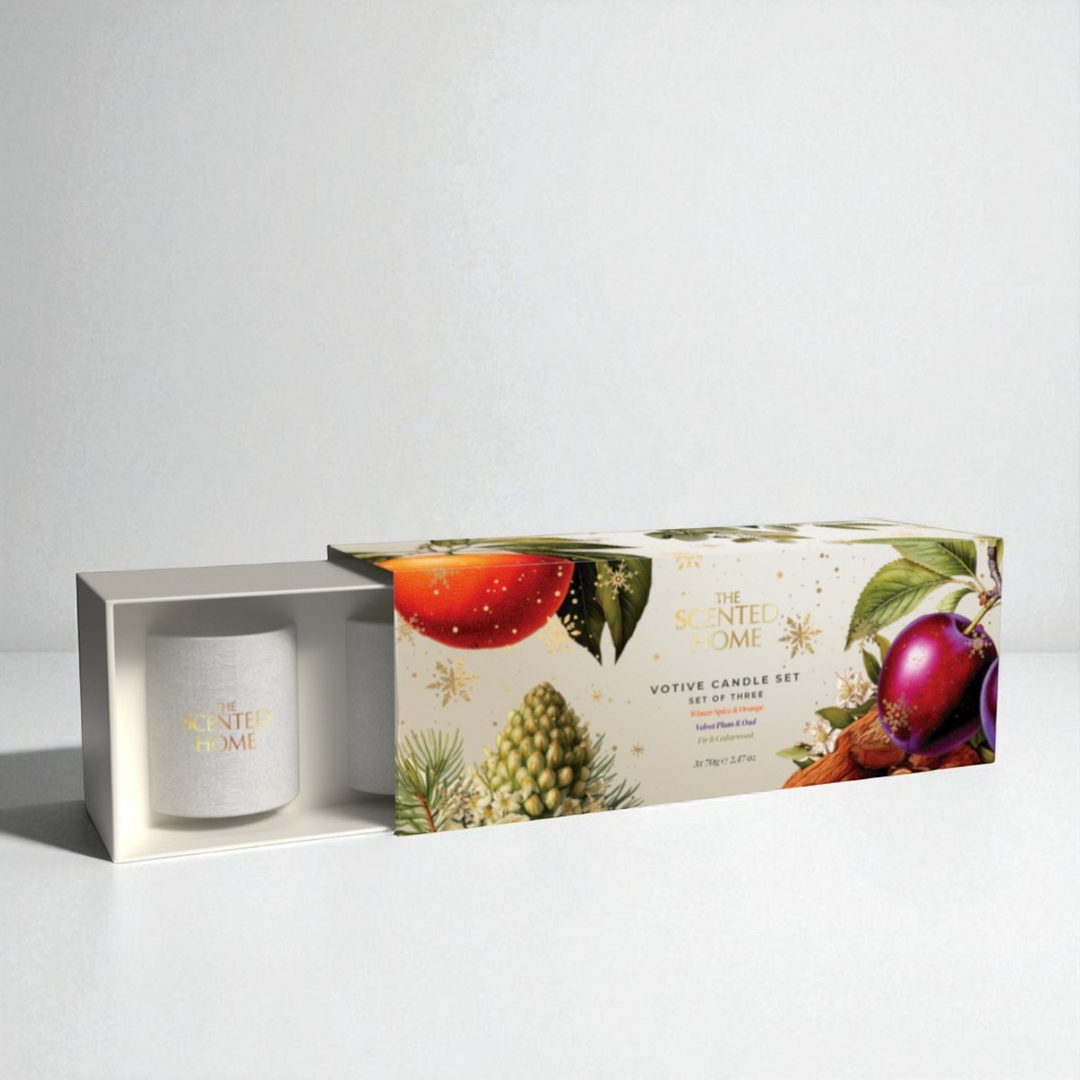 Votive candle set with decorative packaging on a white background