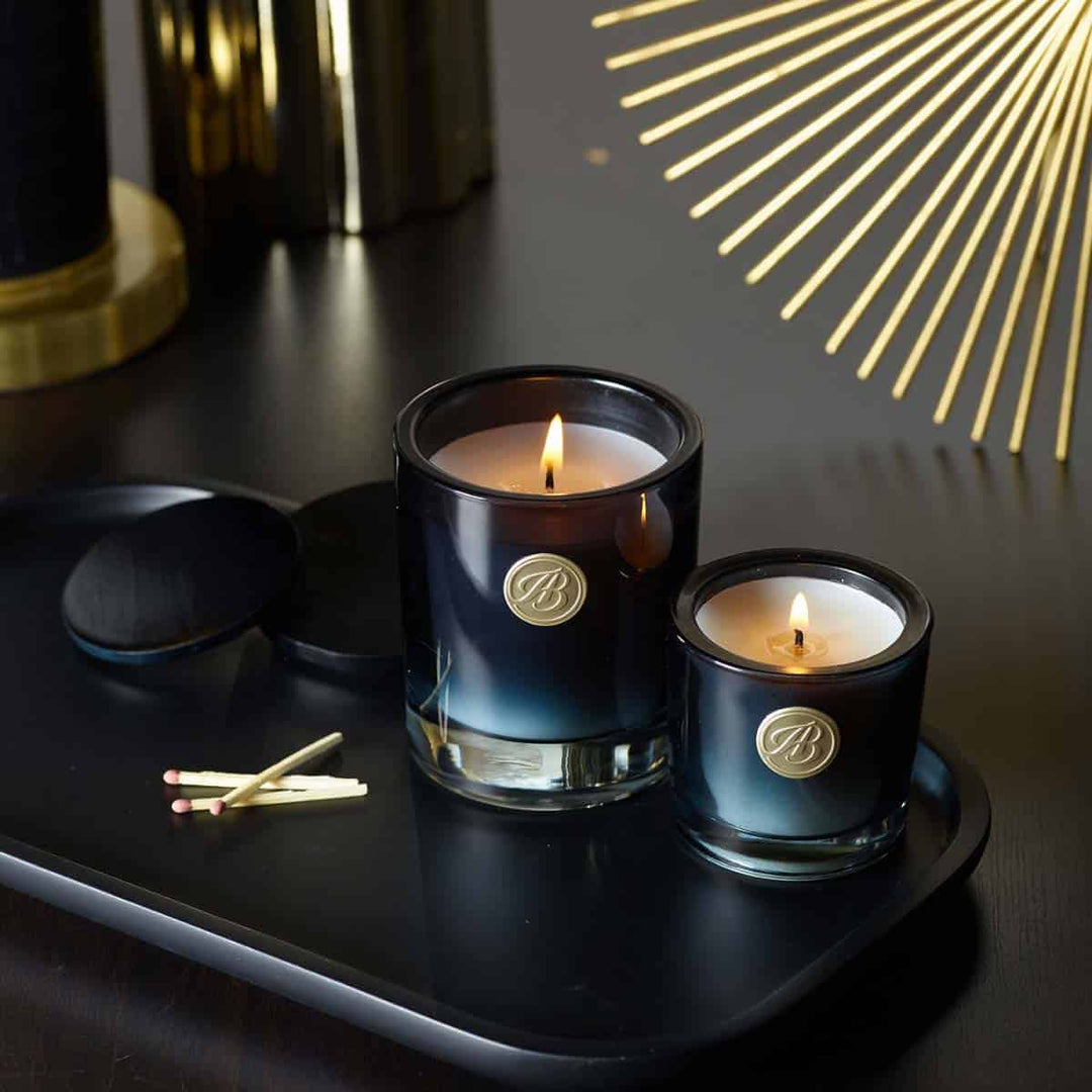 Sicilian Lemon Scented Candles of different sizes lit side by side