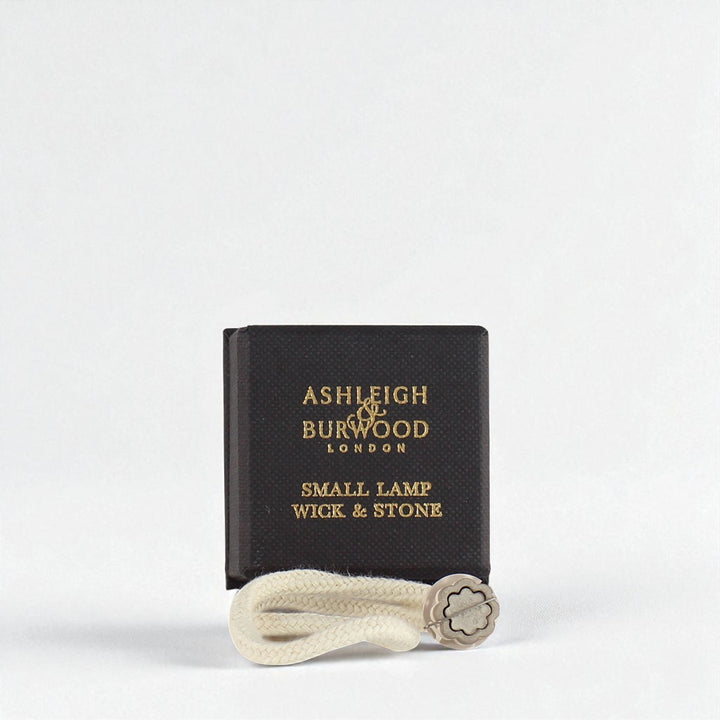 A picture of a boxed small replacement wick against a white neutral background