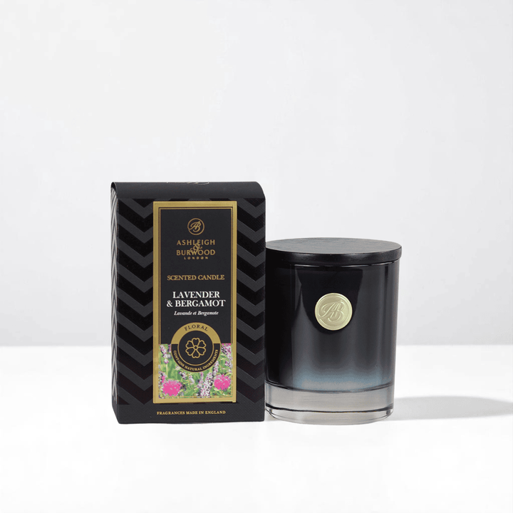 Freesia and Orchid Signature Scented Candle against a white neutral background