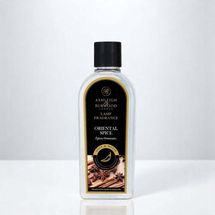 A bottle of Oriental Spice Lamp Fragrance against a white neutral background