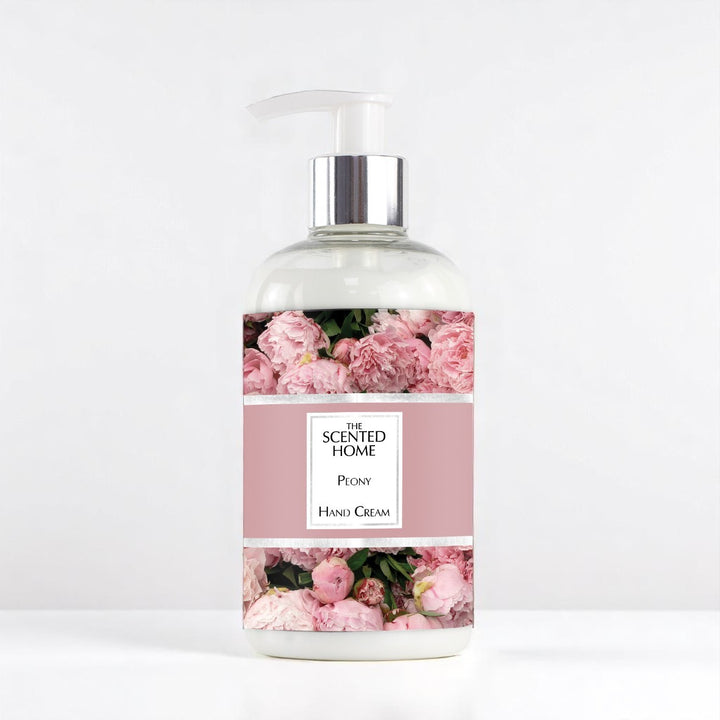 A bottle of Peony Handcream against a white neutral background