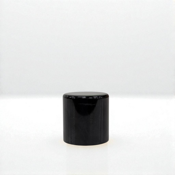 Black cylindrical object on a white background