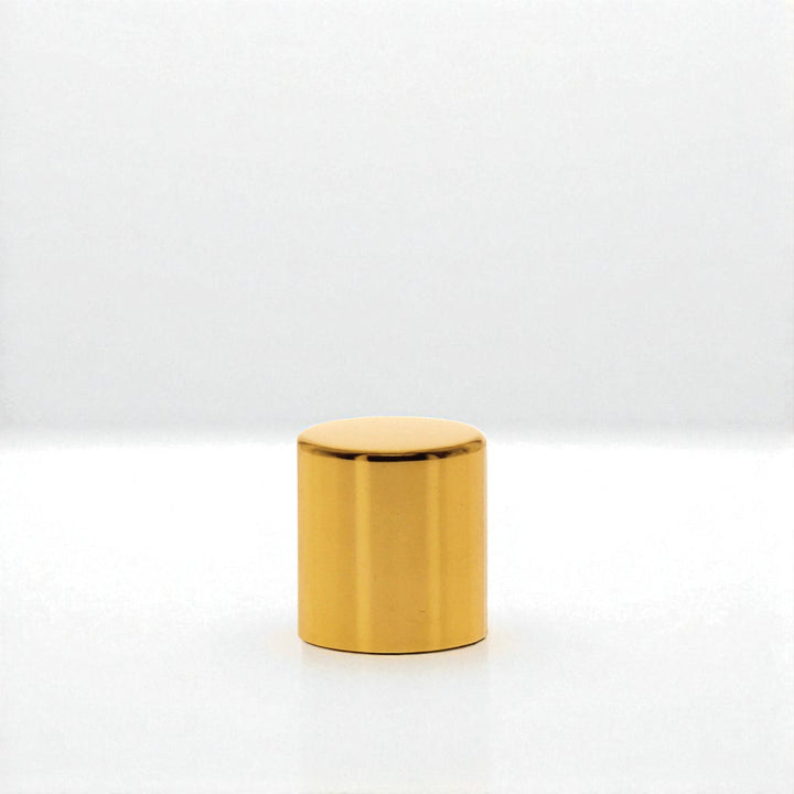 Gold cylindrical object on a white background