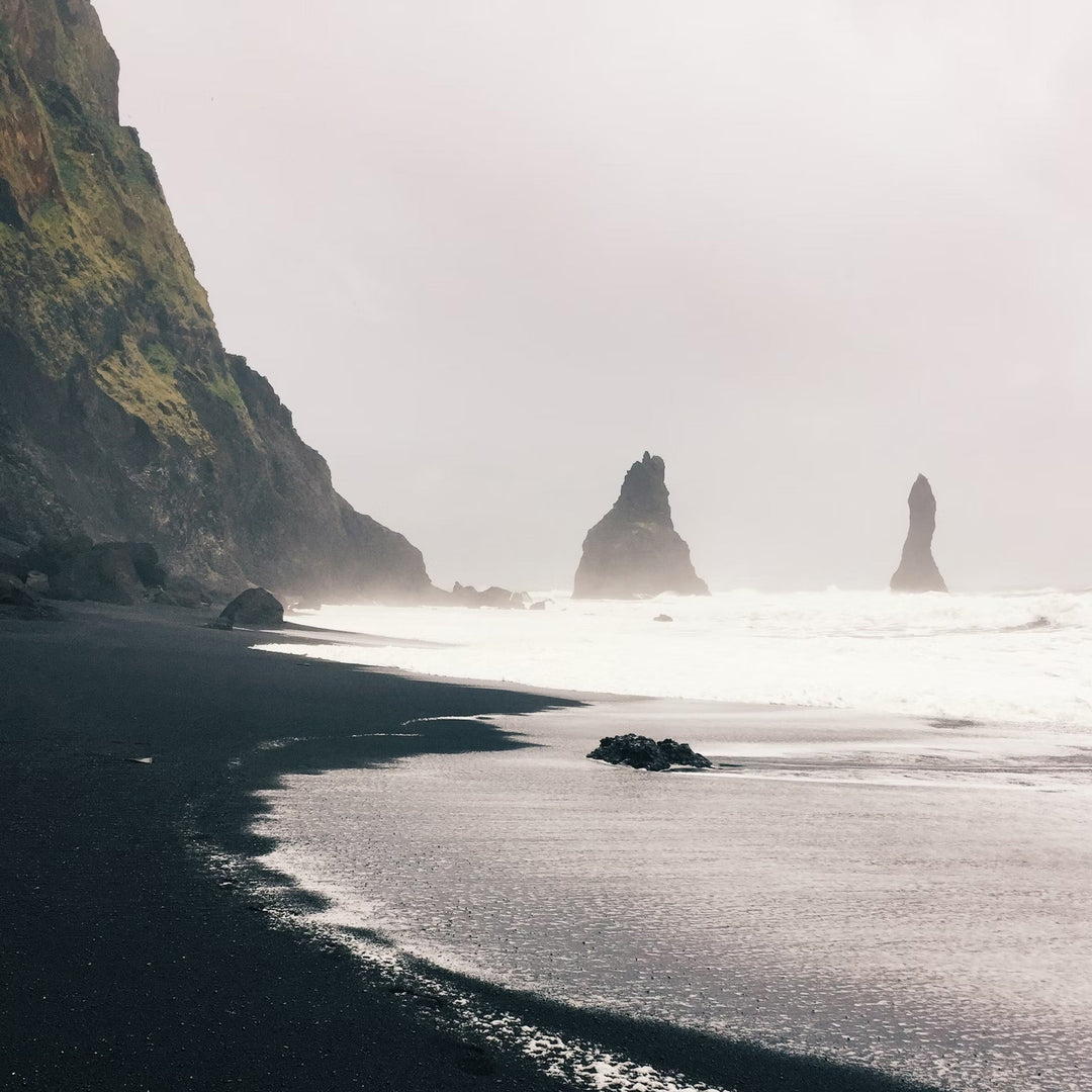 Icelandic beach with dark sand and mist