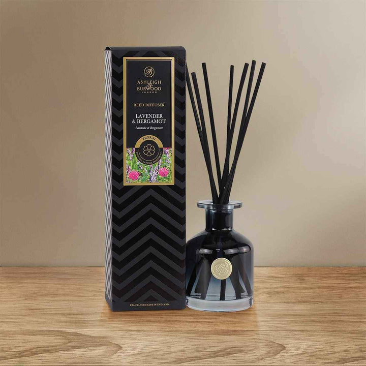 Lavender & Bergamot Signature Reed Diffuser sitting on a wooden surface