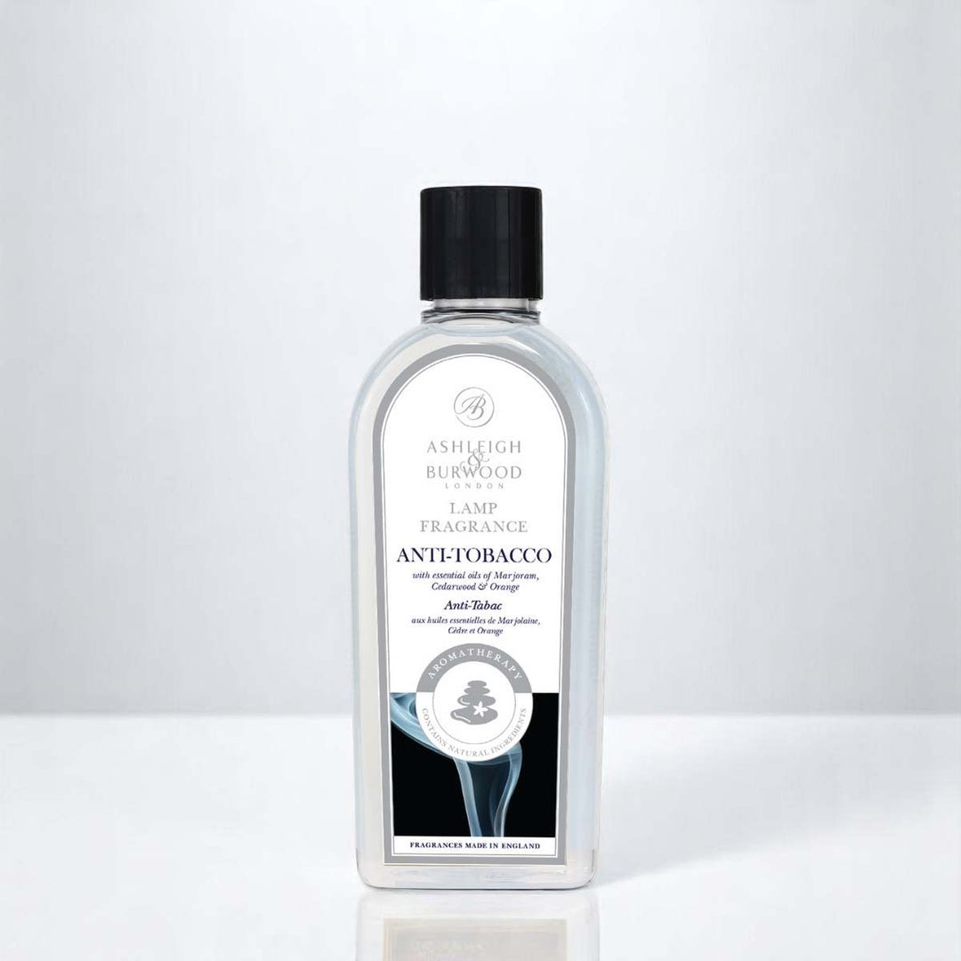 A bottle of Anti Tobacco Lamp Fragrance against a white neutral background