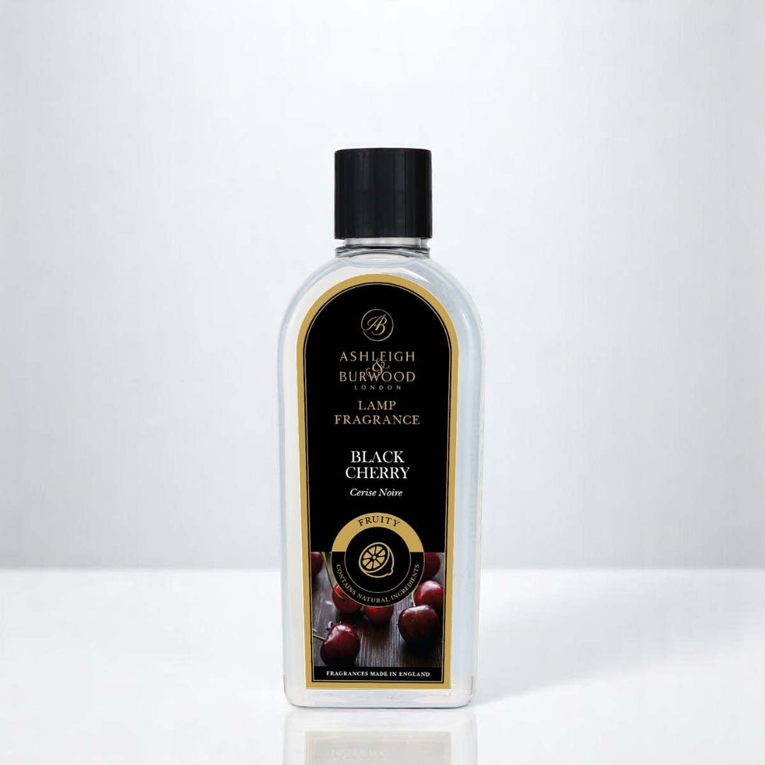 A bottle of Black Cherry Lamp Fragrance against a neutral background