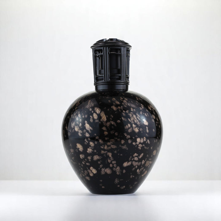 Black Hole Sun Fragrance lamp against a white neutral background