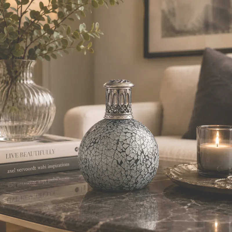 Decorative vase with a crackled texture on a table with books and a candle.