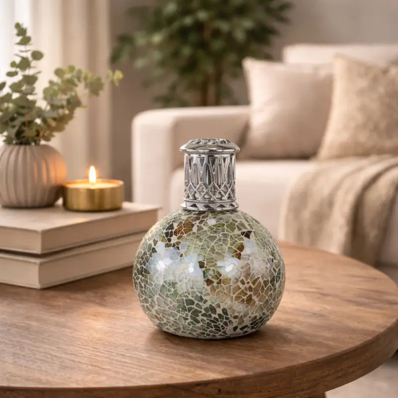 Decorative mosaic lamp on a wooden table with a cozy living room background