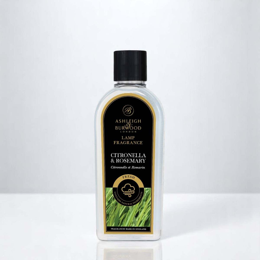 A bottle of Citronella & Rosemary Lamp Fragrance against a white neutral background
