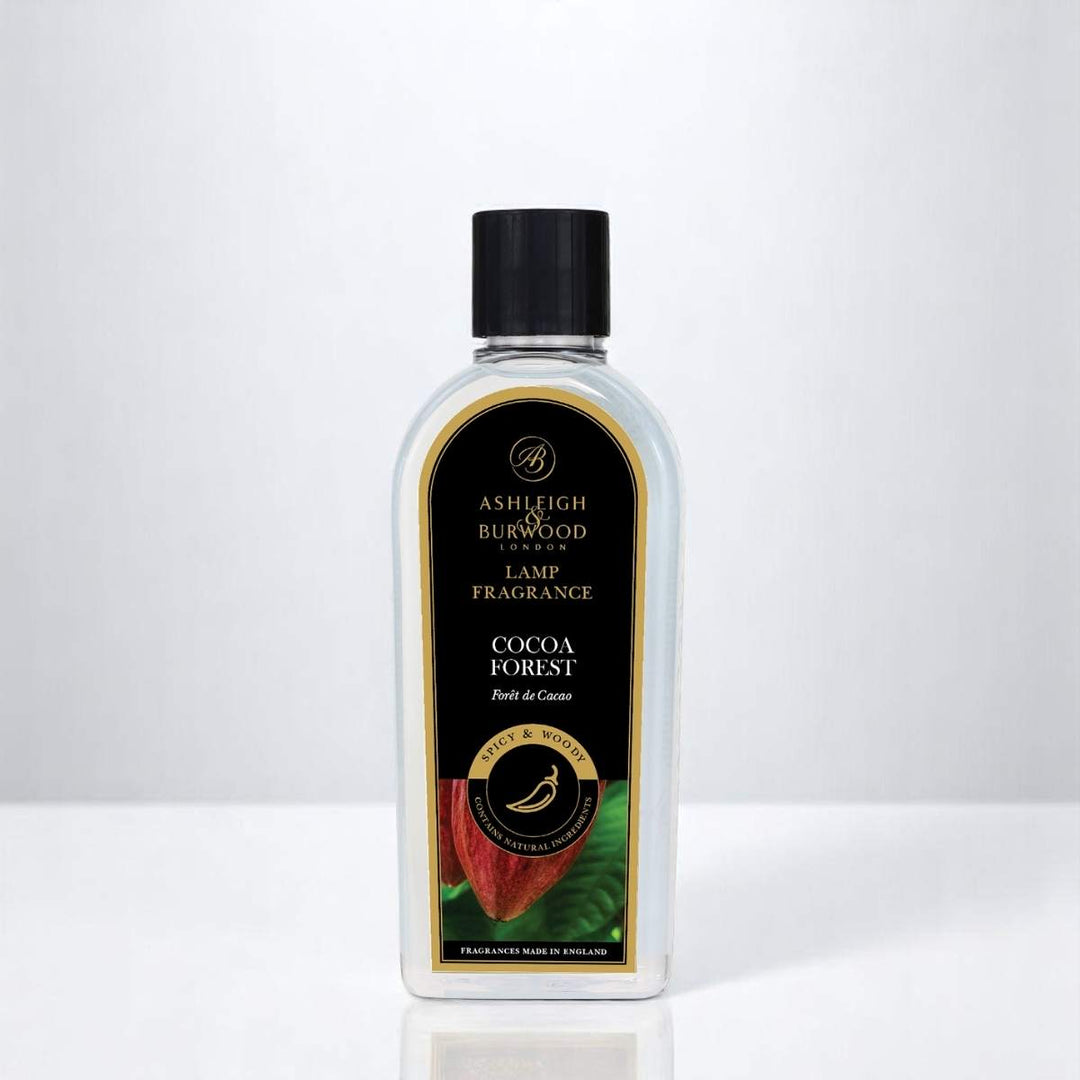 A bottle of Cocoa Forest Lamp Fragrance against a white neutral background