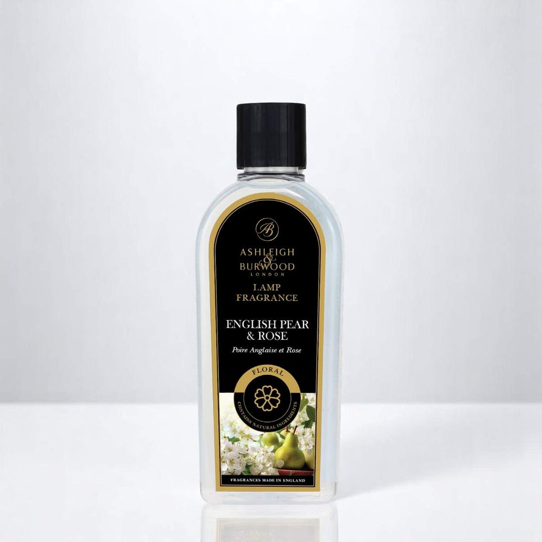 A bottle of English Pear & Rose Lamp Fragrance against a white neutral background