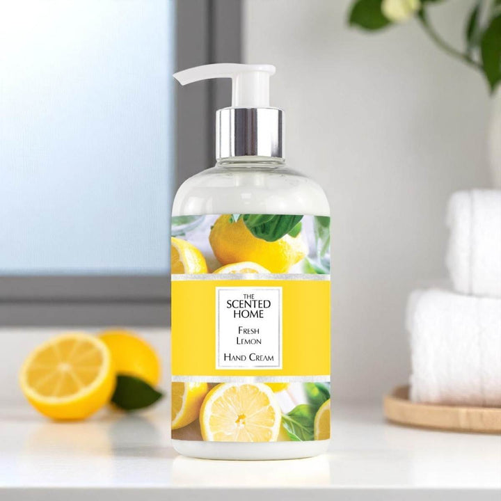 A bottle of Fresh Lemon Hand Cream in a bathroom with Lemon slices in the background