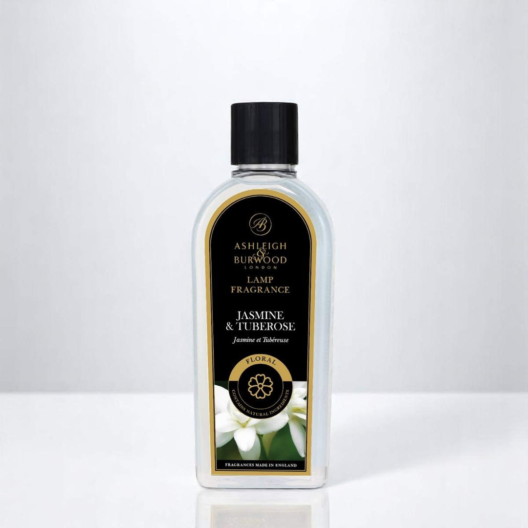 A bottle of Jasmine & Tuberose Lamp Fragrance against a white neutral background