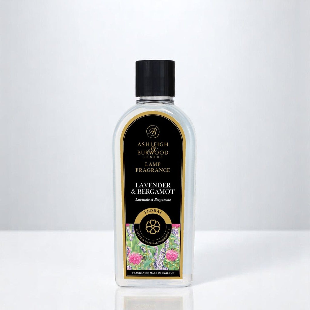 A bottle of Lavender & Bergamot Lamp Fragrance against a white neutral background