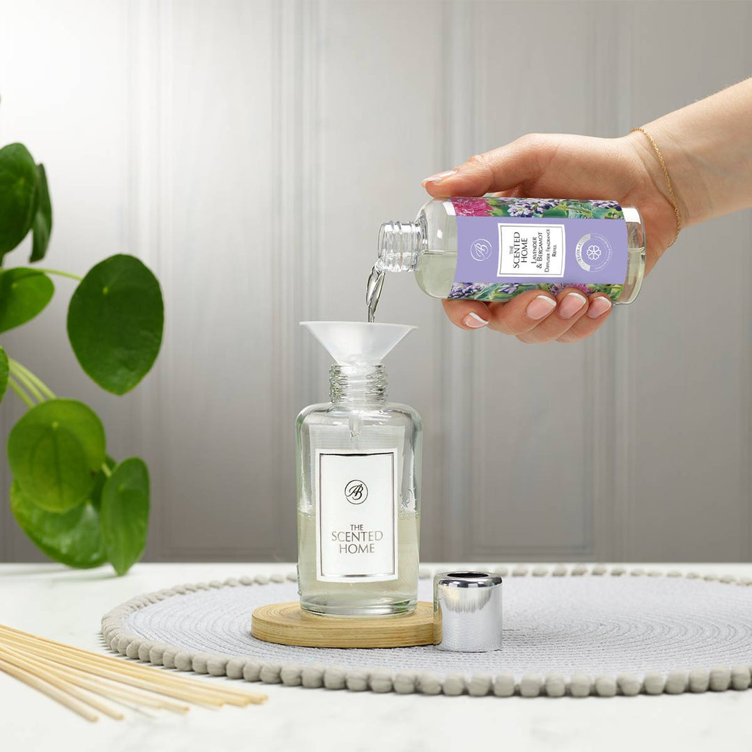 Lavender & Bergamot Reed Diffuser Refill being poured into vessel