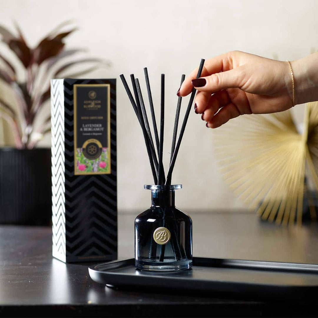 Reeds being placed in Lavender & Bergamot Signature Reed Diffuser