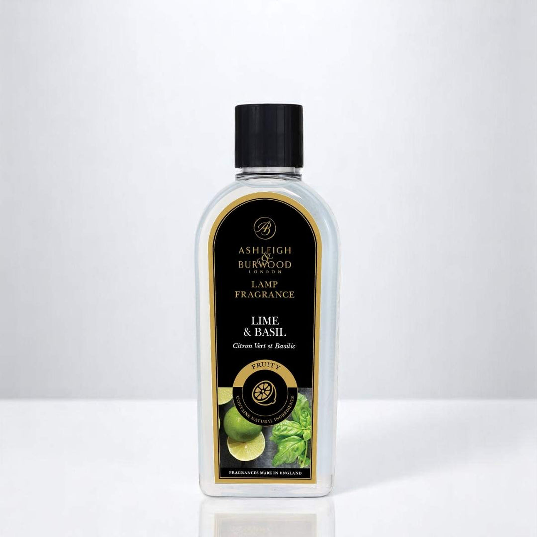 A bottle of Lime & Basil Lamp Fragrance against a white neutral background
