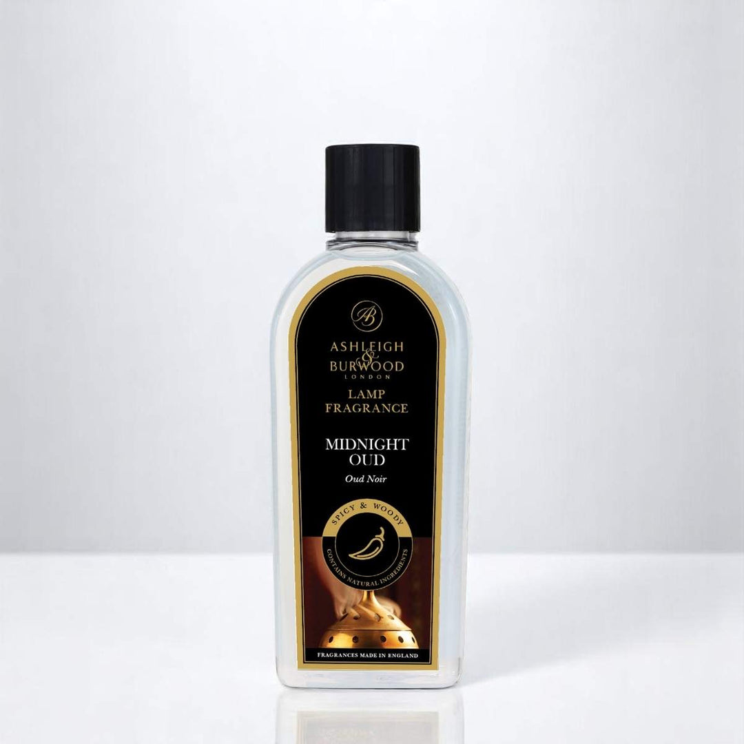 A bottle of Midnight Oud Lamp Fragrance against a white neutral background