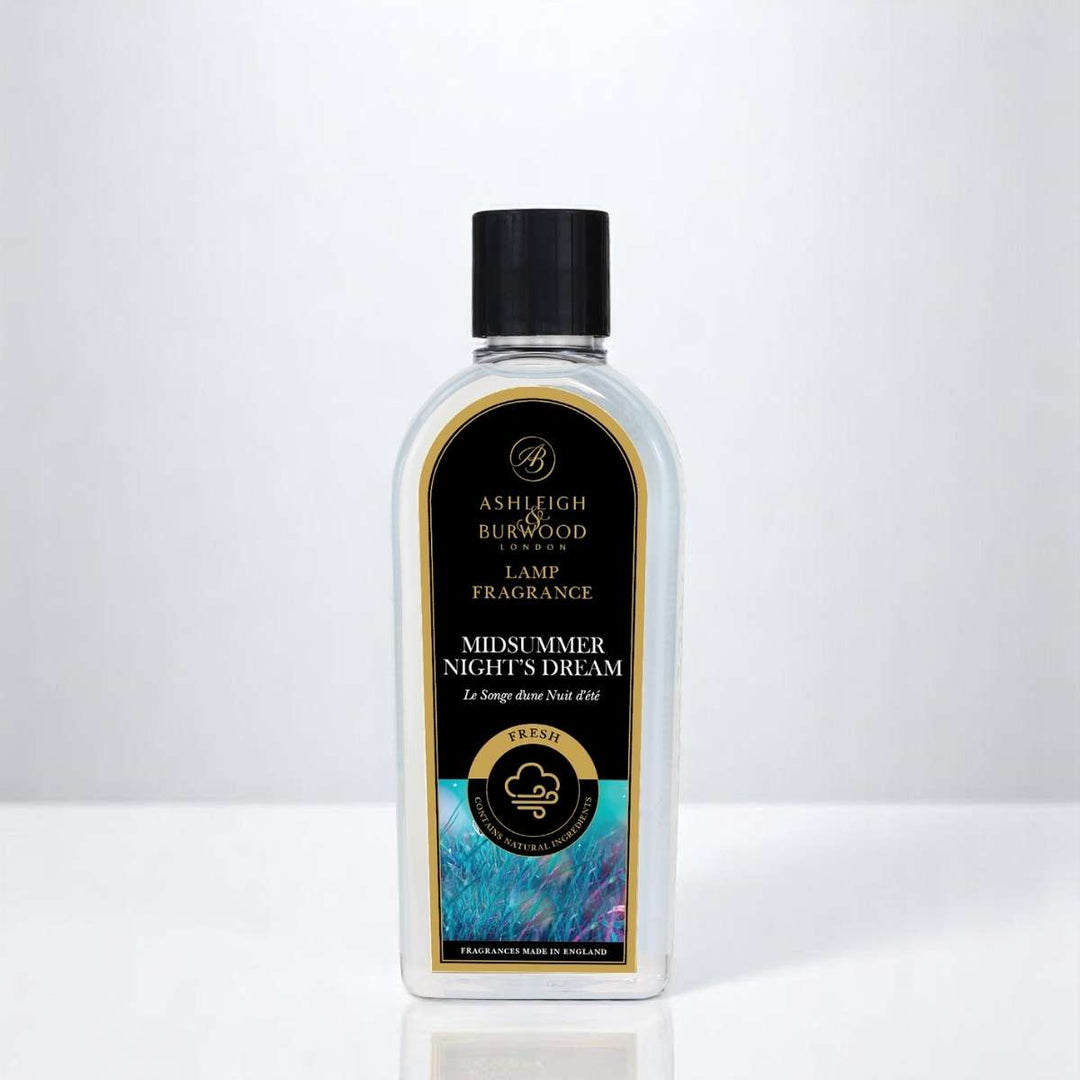 A bottle of Midsummer Nights Dream Lamp Fragrance against a white neutral background