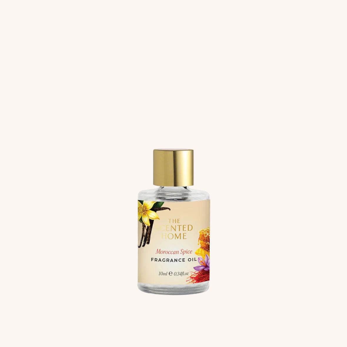 Fragrance oil bottle with floral design on label against a white background