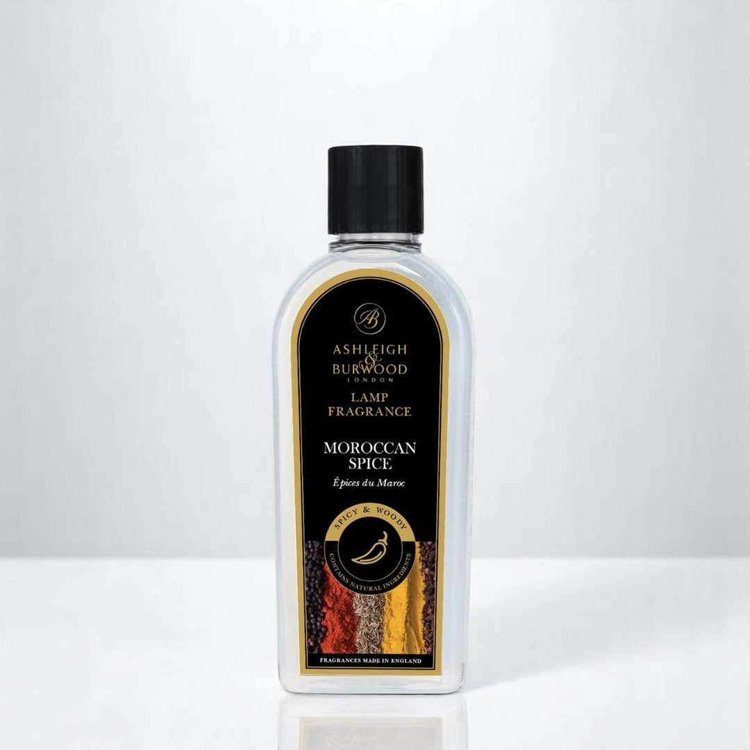 A  bottle of Moroccan Spice Lamp Fragrance against a white neutral background