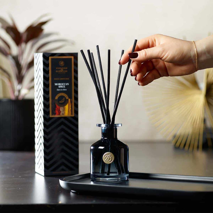 Reeds being placed in Moroccan Spice Signature Reed Diffuser