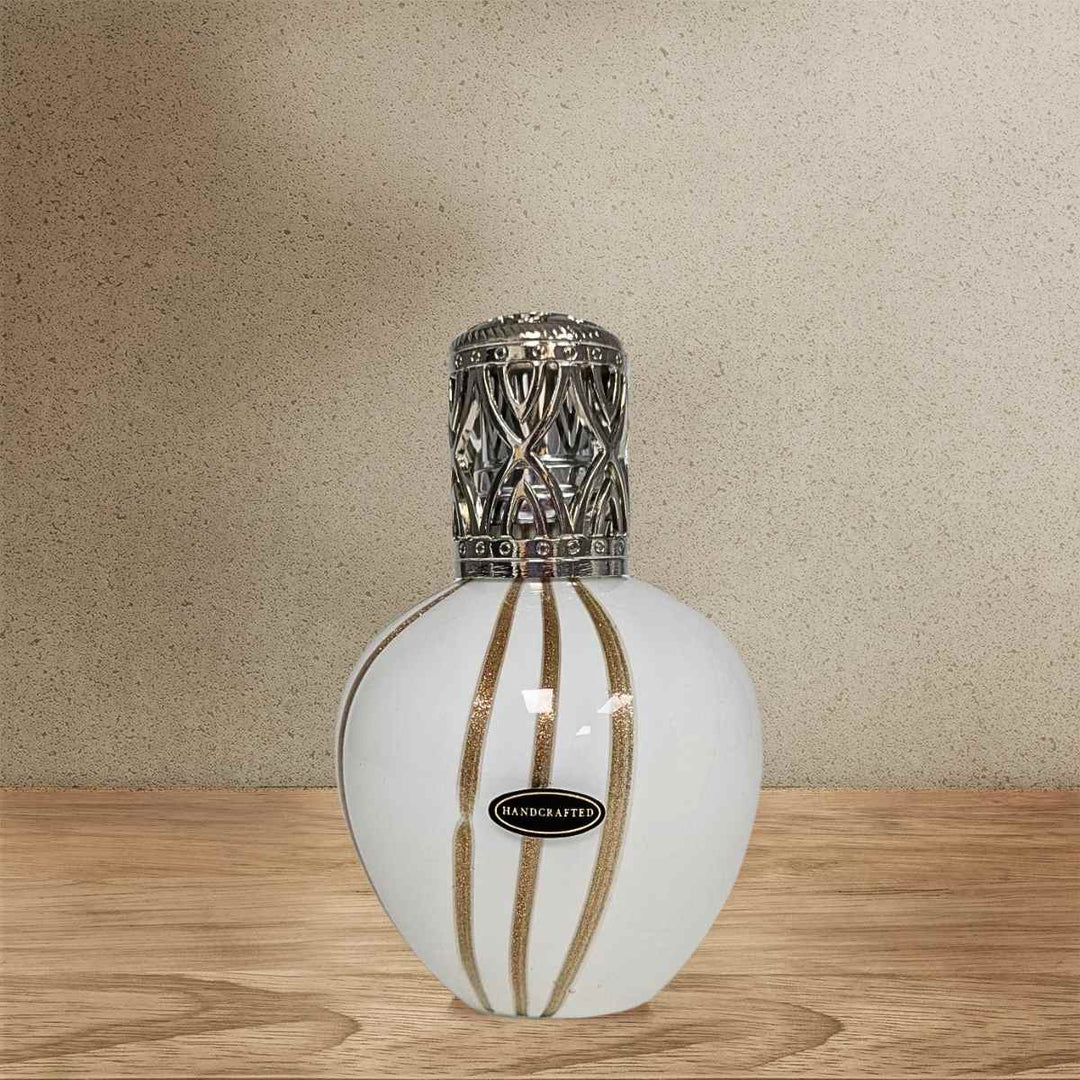 A picture of The Admiral Fragrance Lamp on a wooden surface
