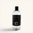 Clear bottle with black label on a white background