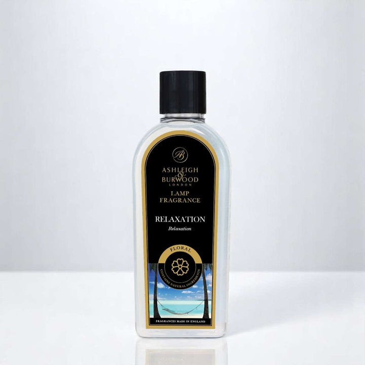 A bottle of Relaxation Lamp Fragrance against a white neutral background