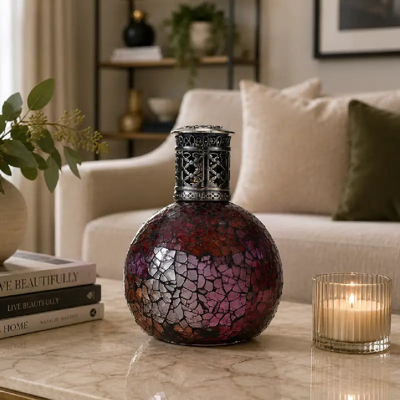 Decorative vase with mosaic design on a coffee table in a living room setting