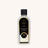 A bottle of Pearl & Magnolia Lamp Fragrance against a white neutral background