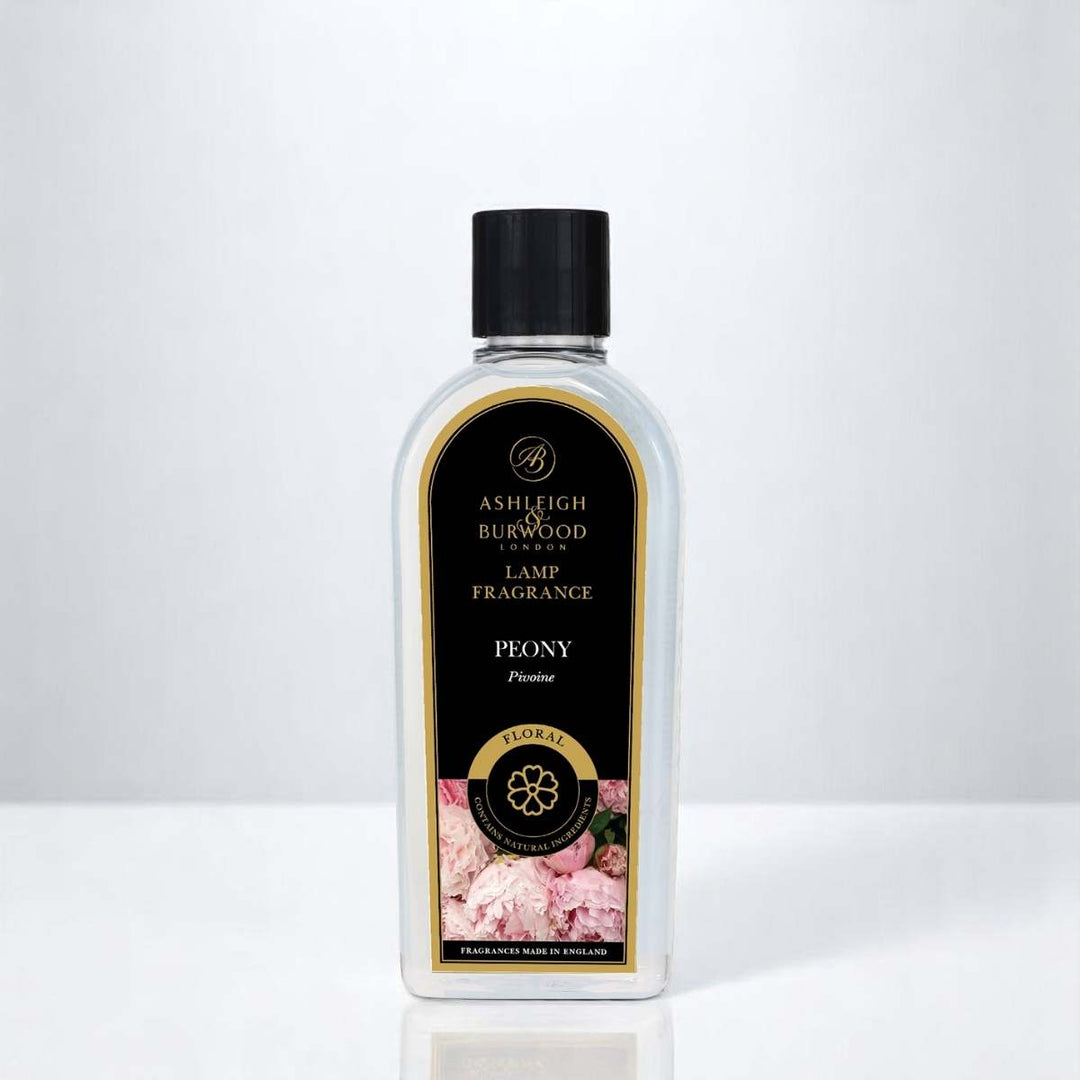 A bottle of Peony Lamp Fragrance against a white neutral background