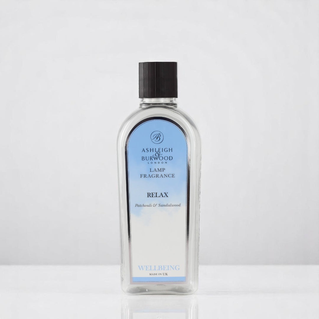 A bottle of Relax Lamp Fragrance against a white neutral background