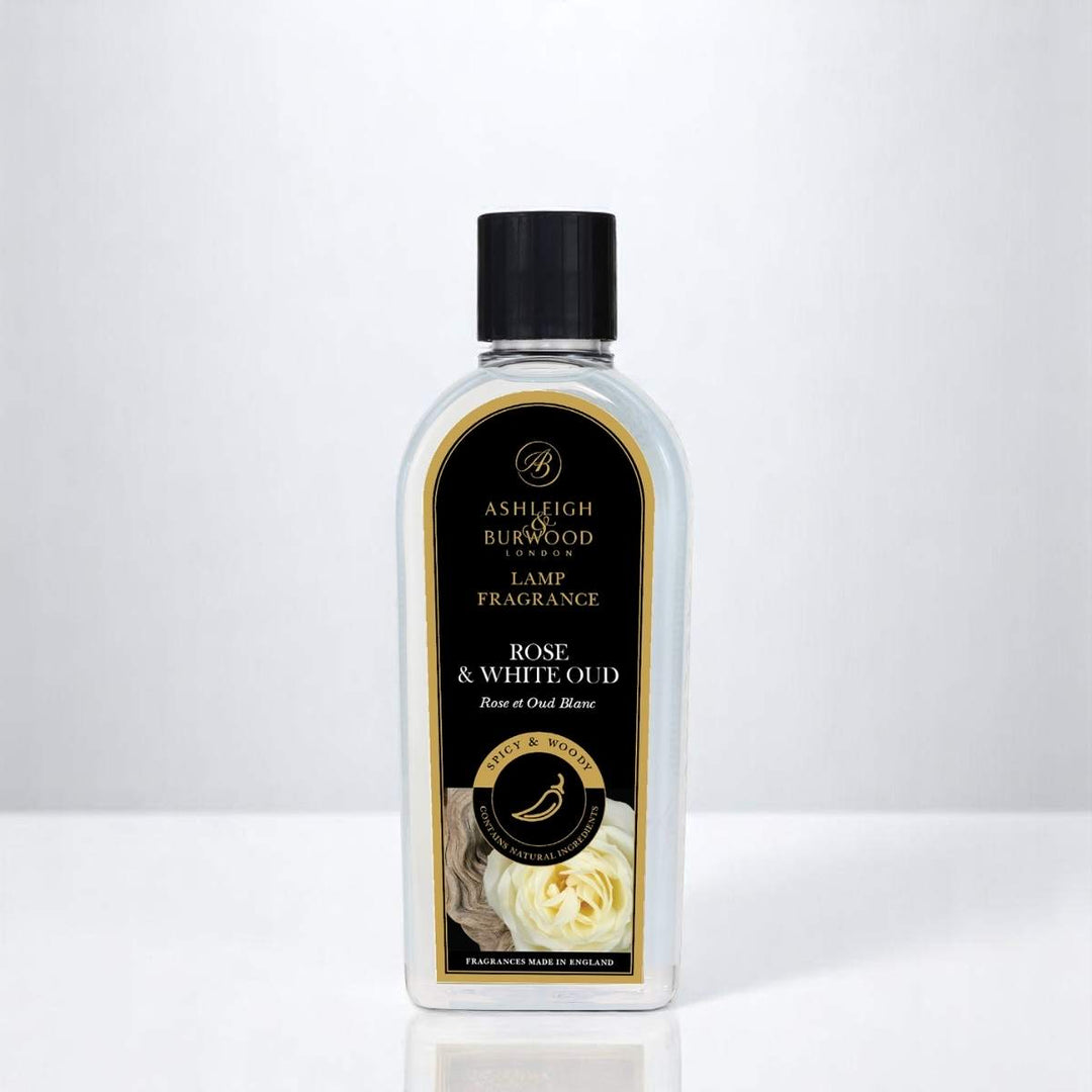 A bottle of Rose and White Oud Lamp Fragrance against a white neutral background