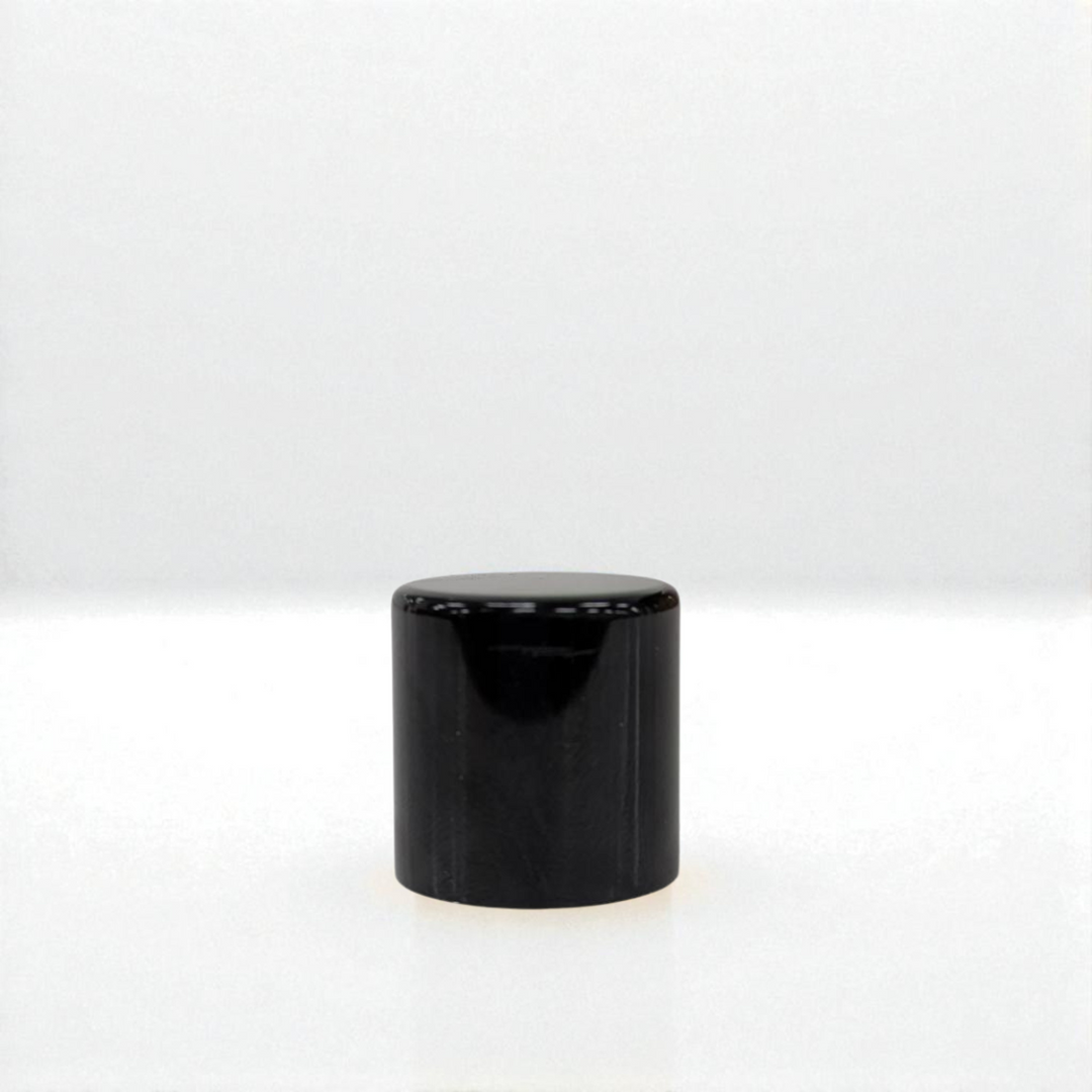 Black cylindrical object on a white background
