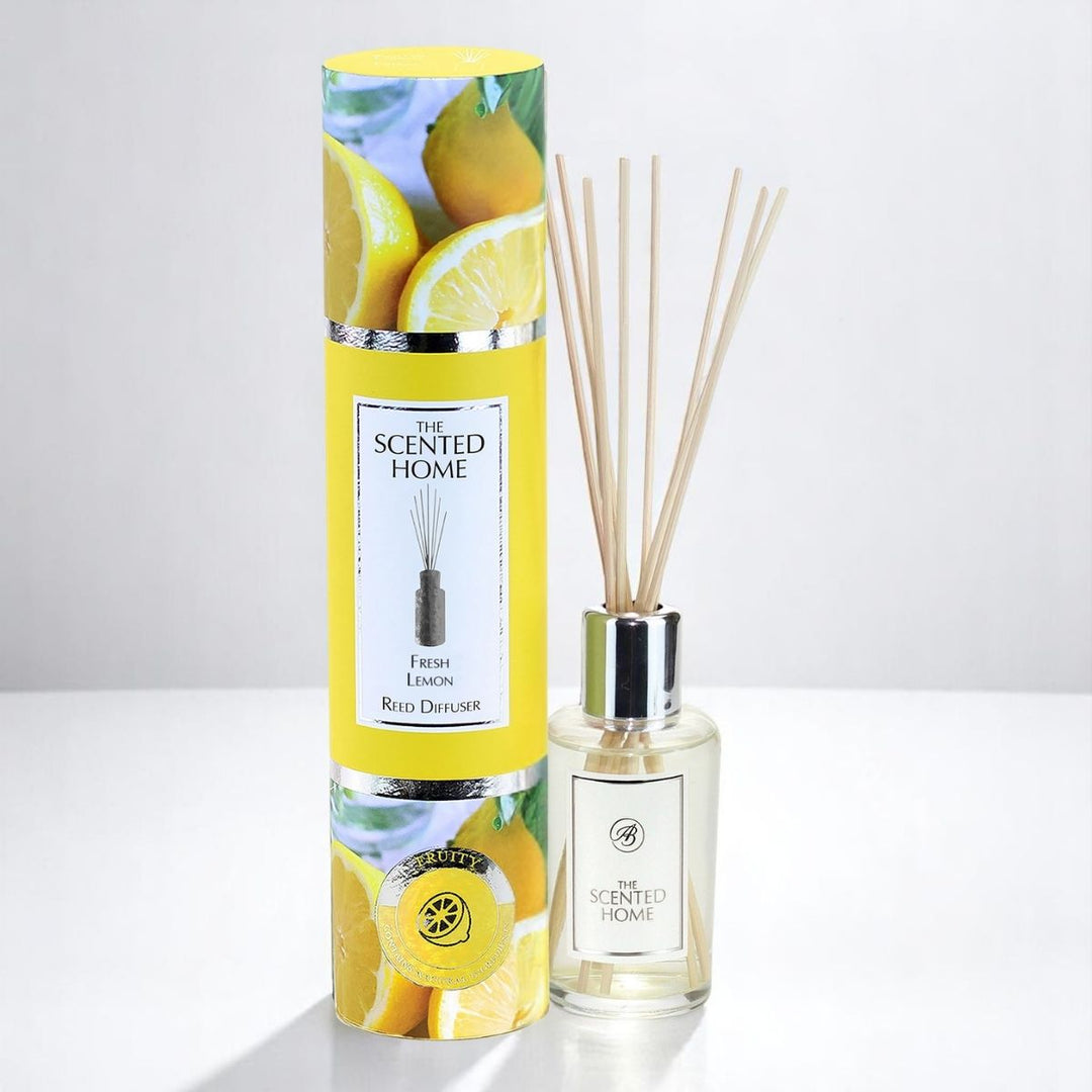 Reed diffuser set with yellow packaging featuring lemons and a clear bottle on a white background.