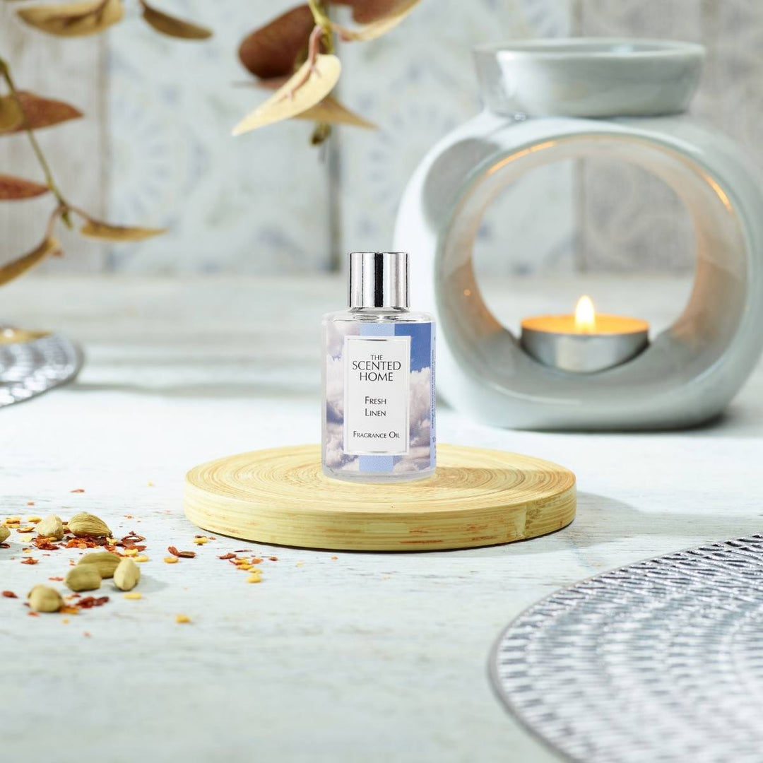 Fresh Linen Fragrance Oil with a burning Oil Burner in the background