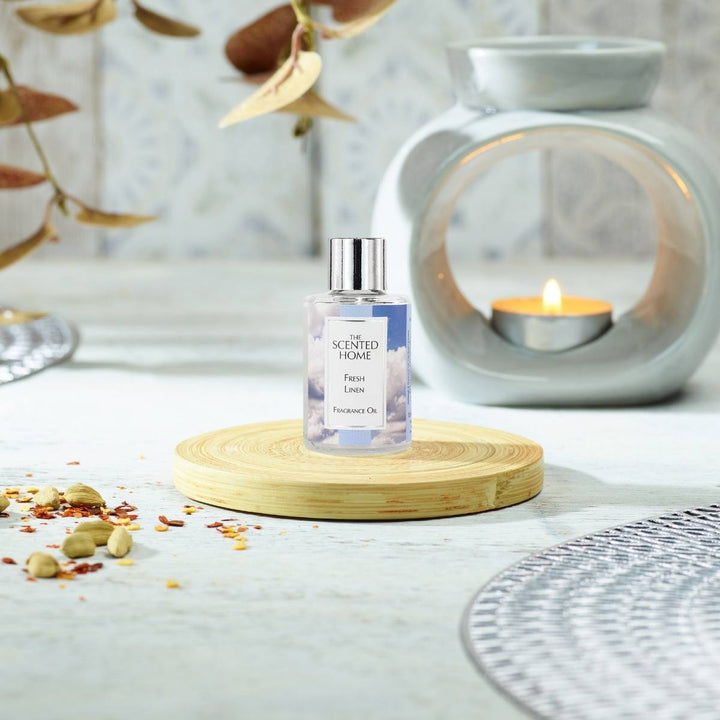 Fresh Linen Fragrance Oil with a burning Oil Burner in the background
