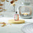 Moroccan Spice Fragrance Oil in the foreground with a burning Oil Burner in the background