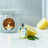 A bottle of Sicilian Lemon Fragrance Oil with a burning Oil Burner in the background