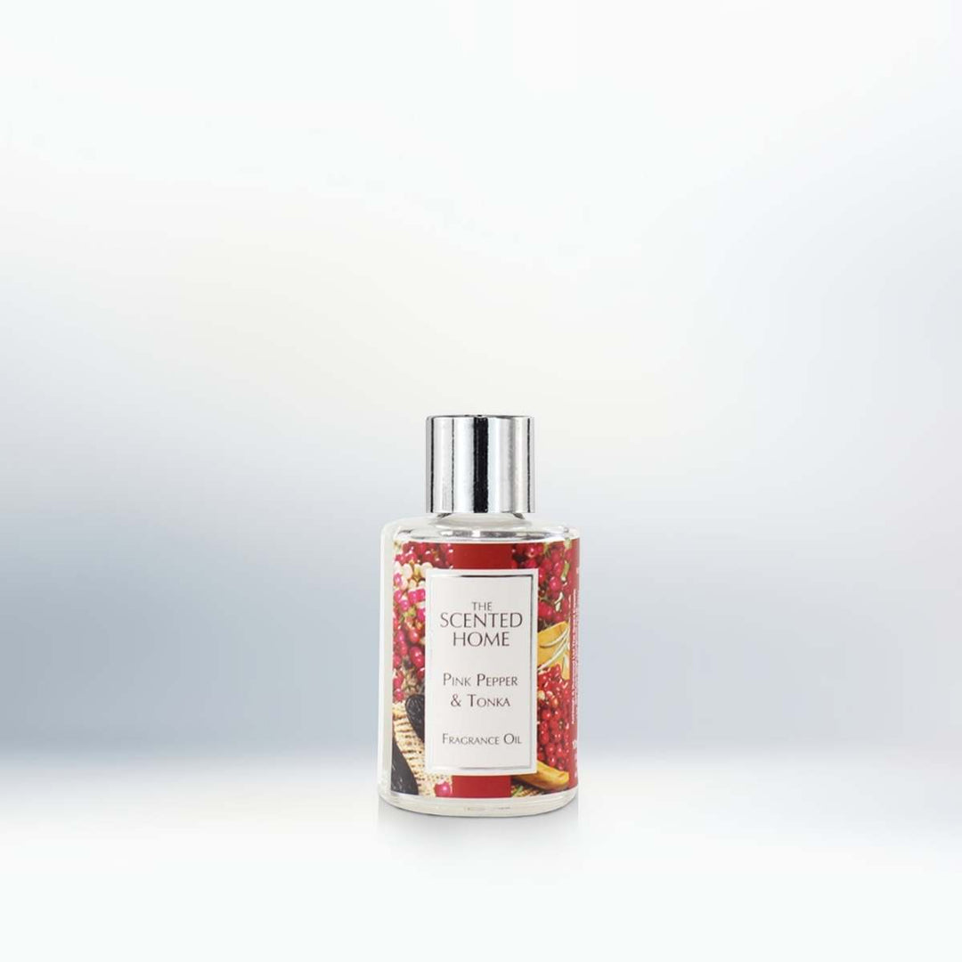 A bottle of Pink Pepper & Tonka Fragrance Oil on a neutral background