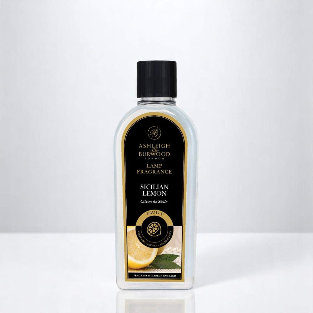 A bottle of Sicilian Lemon Lamp Fragrance against a white neutral background