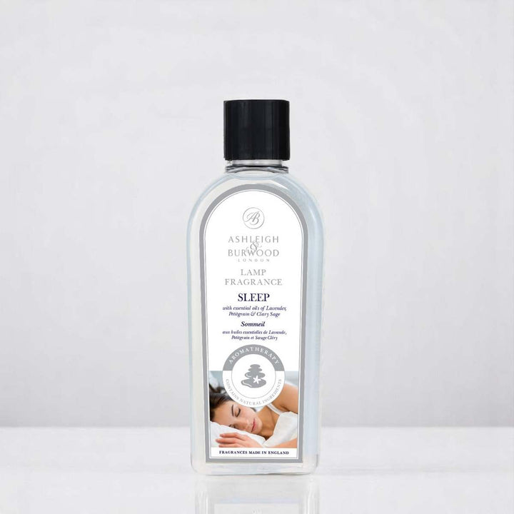 A bottle of Sleep Aromatherapy Lamp Fragrance against a white neutral background