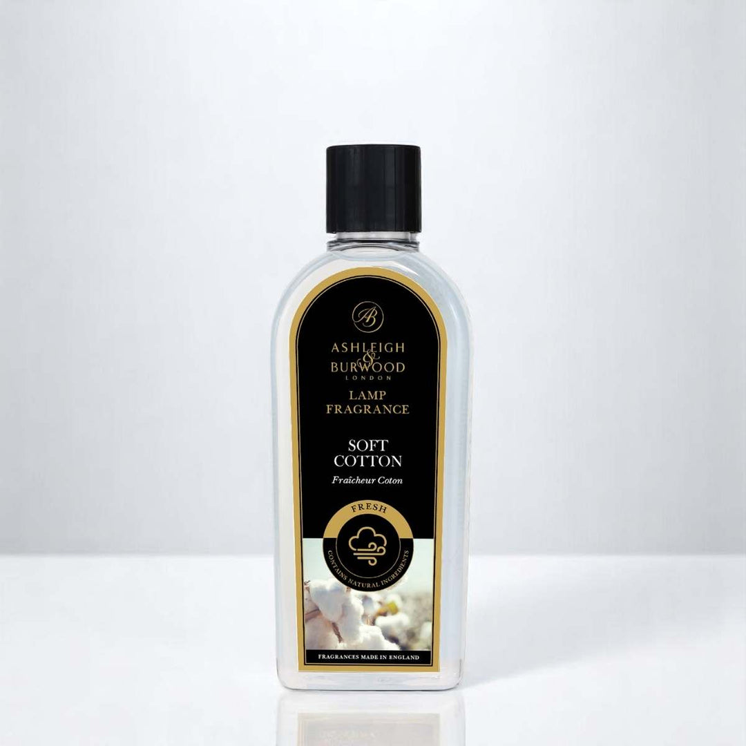 A bottle of Soft Cotton Lamp Fragrance against a neutral background