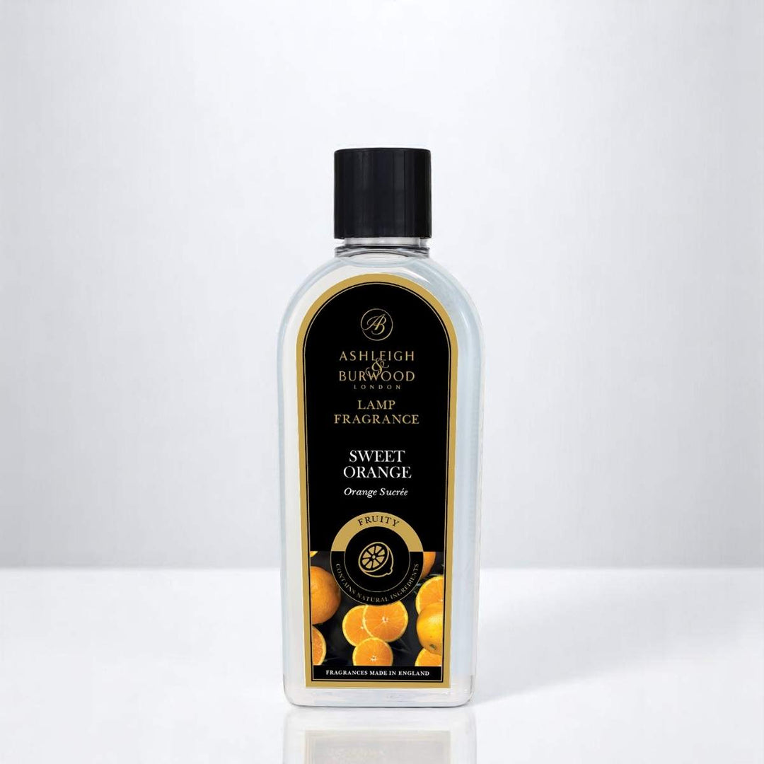 A bottle of Sweet Orange Lamp Fragrance against a white neutral background