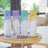 Wellbeing Diffusers on a table with sofa in the background